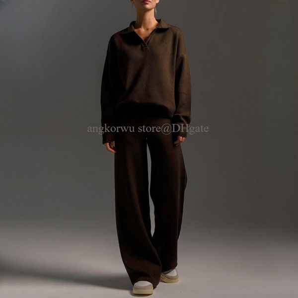A stylish 2-piece designer set featuring a half-zip sweatshirt and straight-leg sweatpants for casual streetwear and sportswear