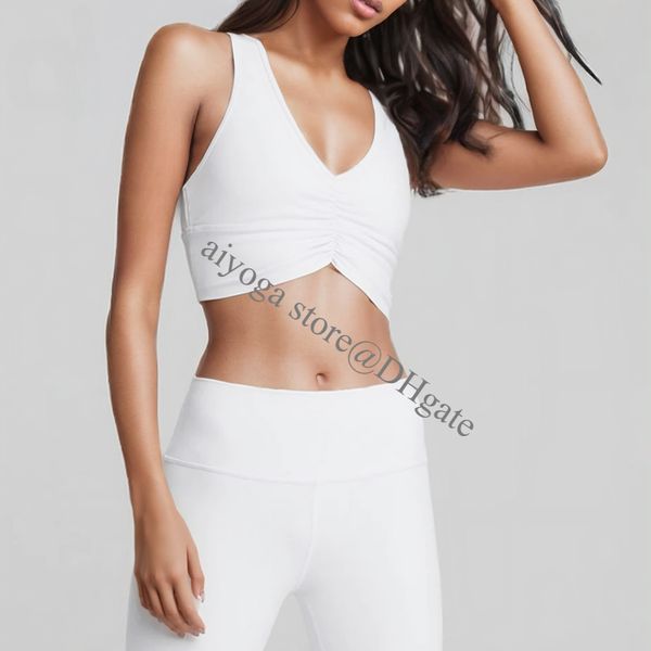 A stylish 2-piece yoga set featuring a sports bra with front ruching and elastic sweatpants in a nude color, designed for breathability and comfort