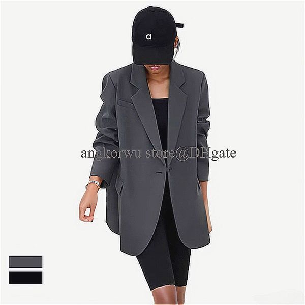 A stylish oversized women's blazer with classic lapels, flap pockets, and long sleeves for a casual yet elegant look