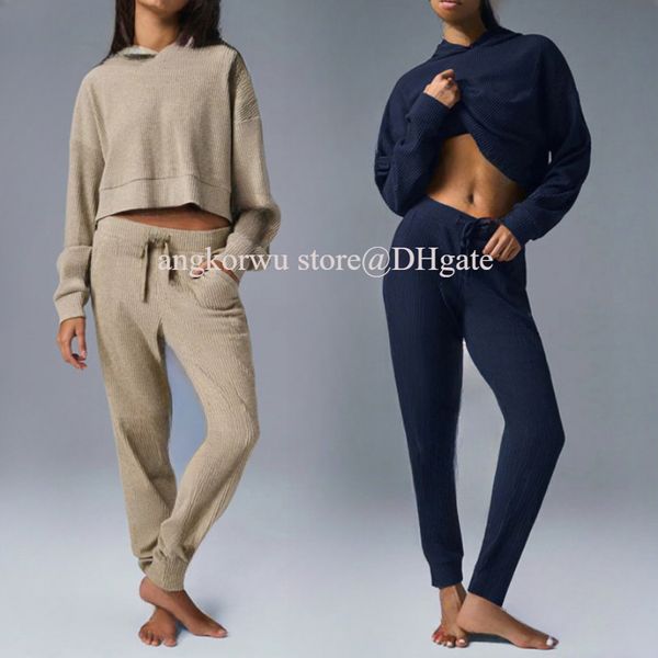 A stylish two-piece yoga set featuring a loose hooded sweatshirt and jogger pants for casual streetwear and exercise