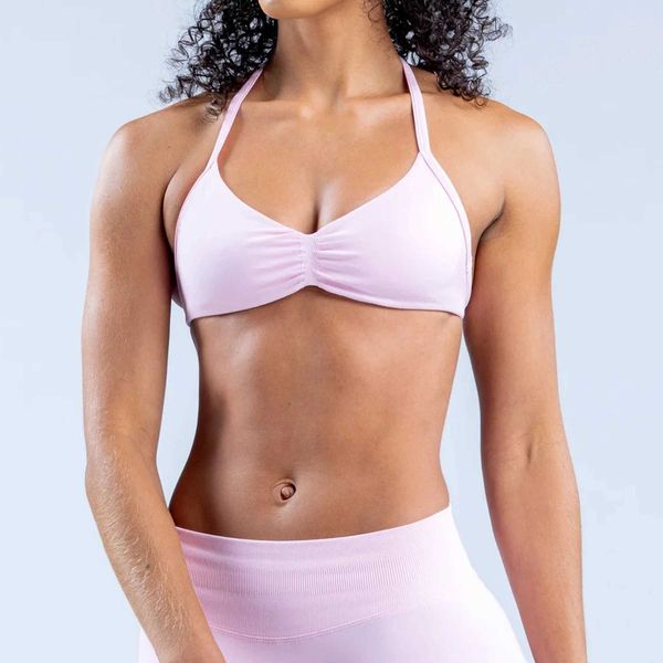 Backless sports bra with detachable cups and adjustable shoulder straps for yoga and gym workouts