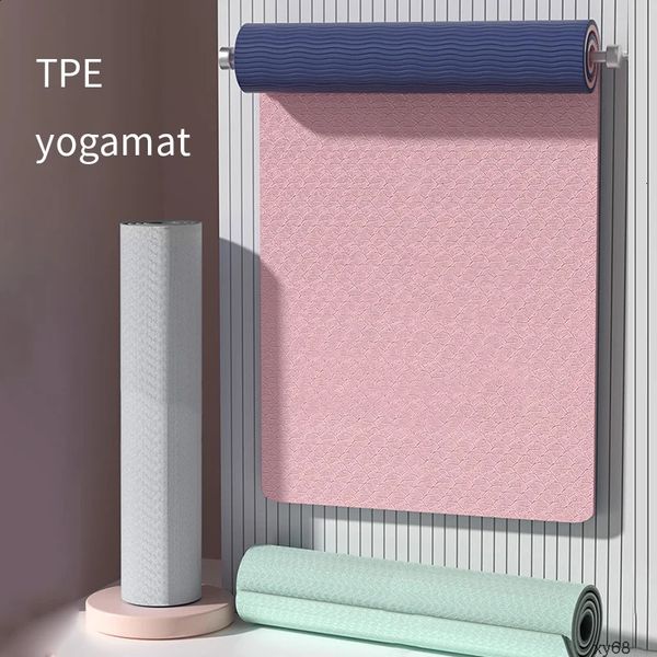 Double-sided non-slip eco-friendly TPE yoga mat with strap for men and women, ideal for yoga, Pilates, and exercise