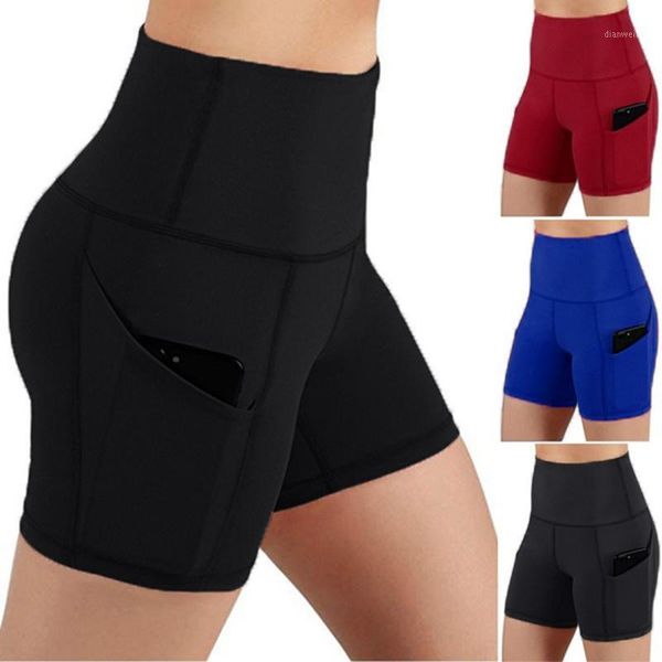 High-waisted yoga shorts featuring tummy control, side pockets, and ideal for workouts, running, and gym activities