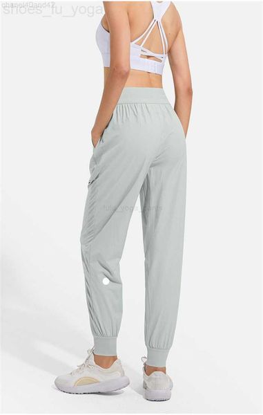 LULL Women's stretchy high-rise jogging leggings with pockets and drawstring for comfortable workouts