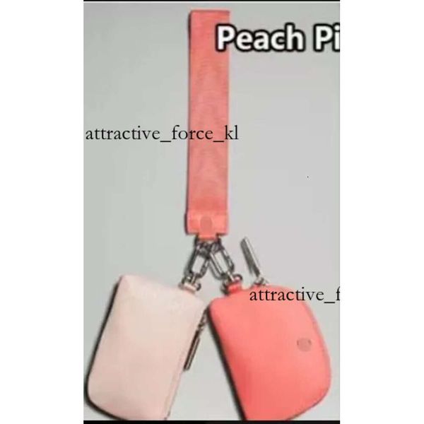 Lululemon's stylish dual pouch wristlet clutch for women, featuring a detachable keychain and waterproof design, perfect as a mini yoga bag or designer wallet