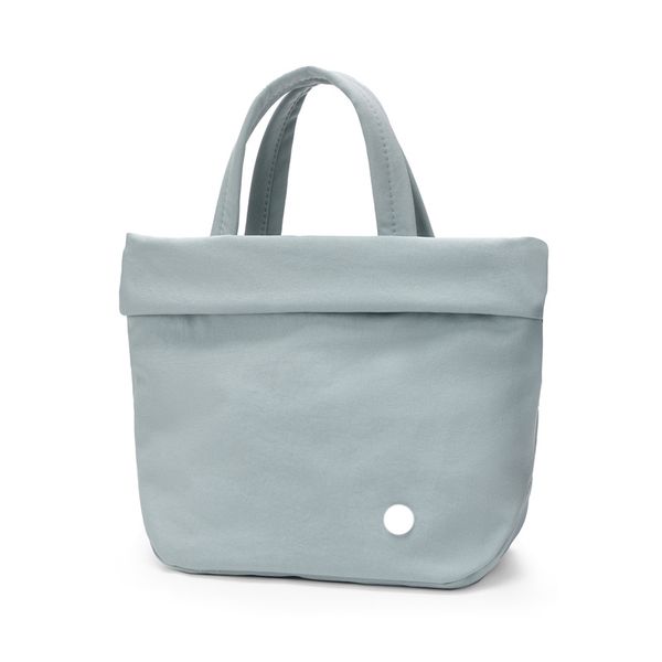 Luxurious waterproof tote bag for women with 5L capacity, brand logo, and crossbody or shoulder carry options