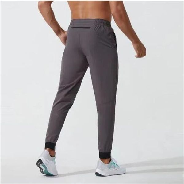 Men's jogger pants for sports and yoga, featuring quick-dry fabric, drawstring waist, gym pockets, and elastic comfort