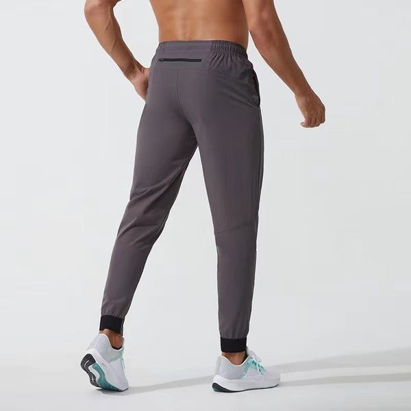 Men's stretchy jogger pants for sports and gym with quick-dry fabric, drawstring waist, and pockets