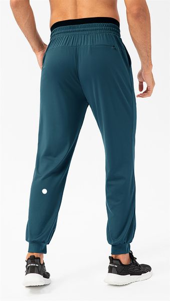 Men's stretchy jogger pants with drawstring waist, quick-dry fabric, side pockets for gym and casual wear