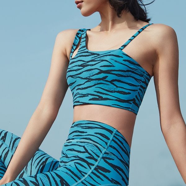 New leopard print yoga set for women featuring a crop top and leggings, perfect for gym workouts and fitness wear in 2024