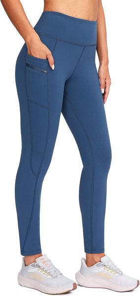 Women's fleece-lined winter leggings featuring pockets, water-resistant material, high waist for warmth, ideal for running and hiking