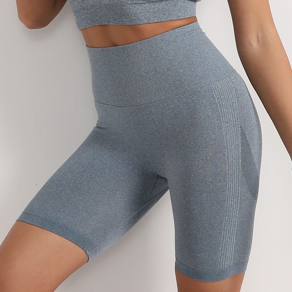 Women’s high-waisted peach workout leggings with elastic fit, hip-lifting design, quick-dry fabric for yoga and fitness