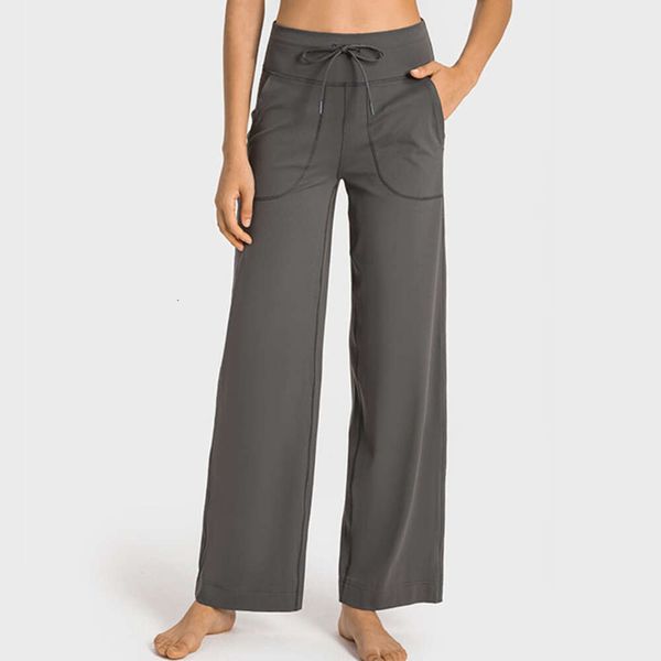 Women's high-waisted wide-leg yoga pants with pockets and drawstring for sports and running