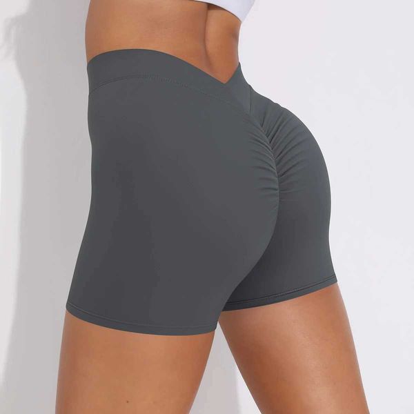 Women's high-waisted yoga shorts for sports, gym workouts, running, and cycling with a peach-colored design