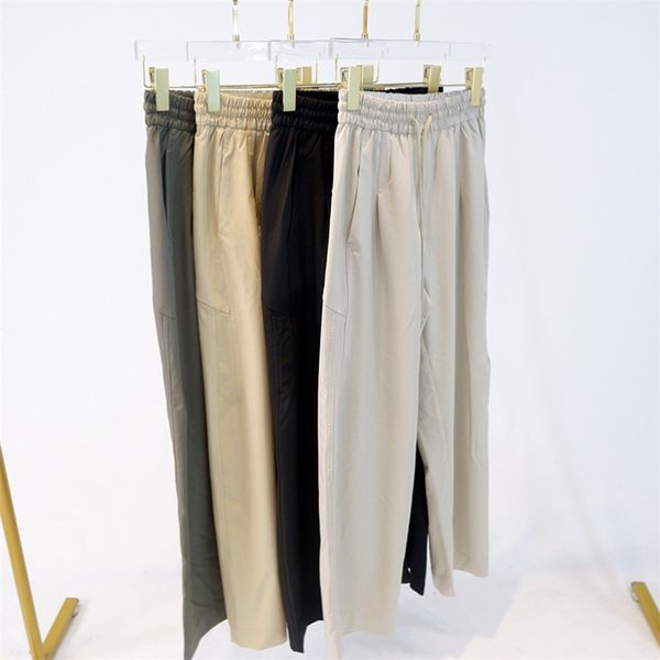 Women's lightweight wide-leg woven pants with a mid-rise fit, straight jogger style and yoga-friendly fabric featuring side pockets