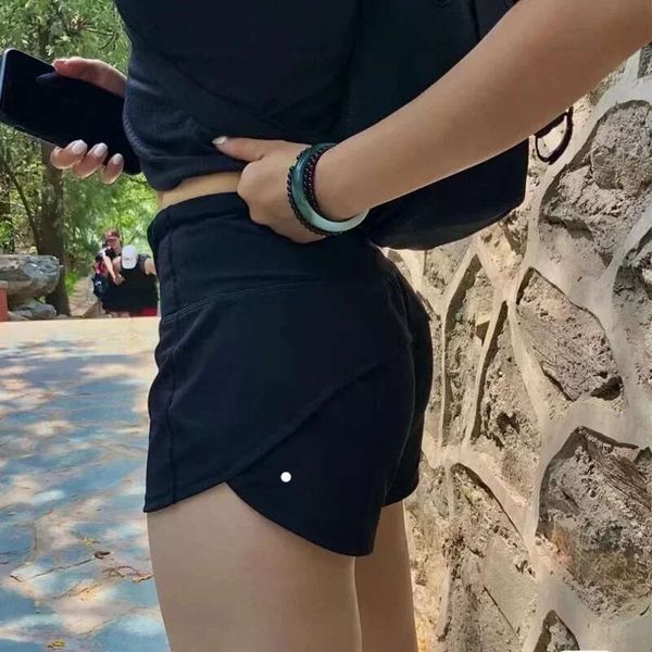 Women's mid-rise running shorts with back zipper pocket and liner for gym training and sports