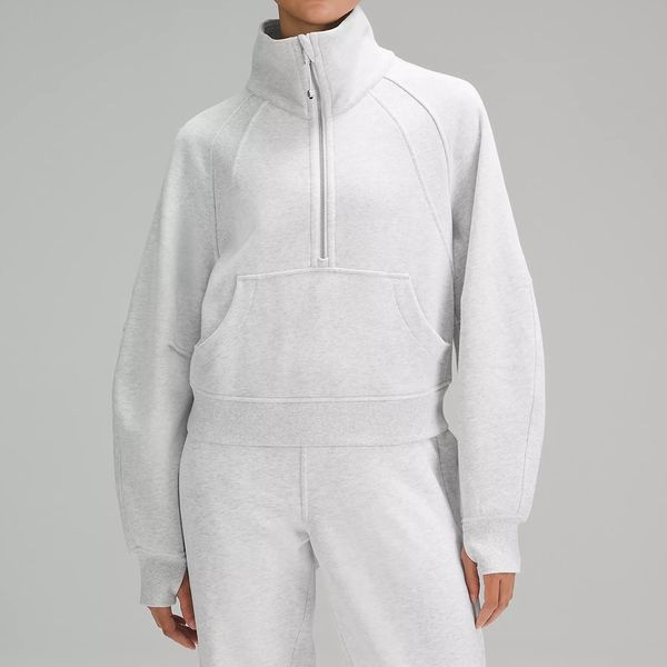 Women's oversized yoga jacket with thumb holes, funnel neck, and half-zip design for gym workouts and running