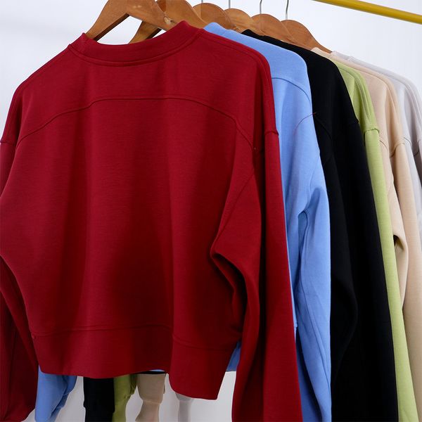 Women's oversized yoga sweatshirt with long sleeves, loose crop top, crew neck, and six color options for workouts