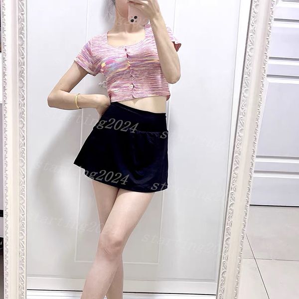 Women's solid color yoga skirt with built-in shorts for tennis, golf, and running, featuring anti-exposure design and elastic waistband