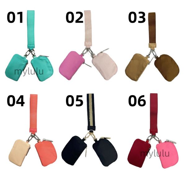 Women's stylish nylon wristlet clutch with dual key pouch, card slots, and coin compartment