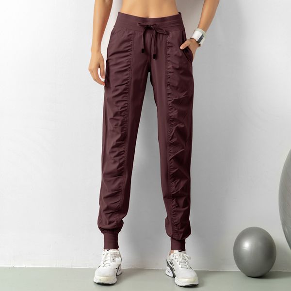 Women's yoga pants for quick-dry workouts, featuring a drawstring waist and loose fit ideal for running, dancing, or studio sessions