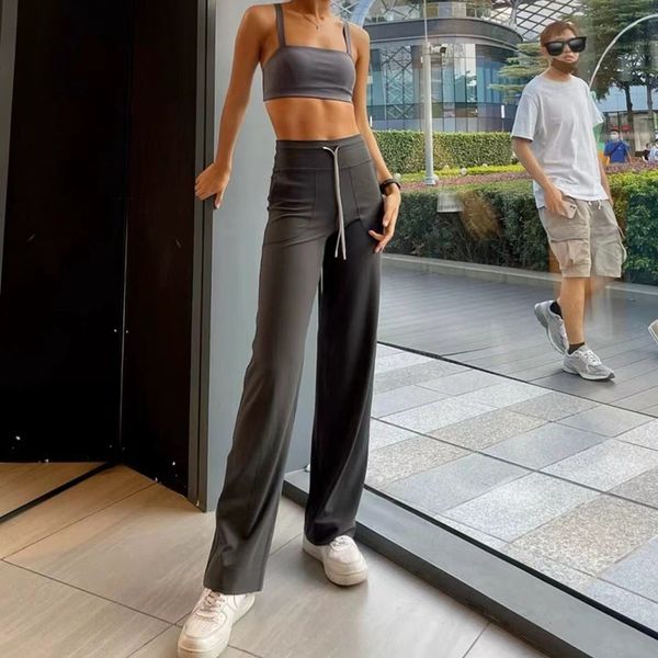 Yoga sweatpants for women with loose wide-leg design, cloud-like comfort, high waist, spring rope detail, side pockets, and flared silhouette