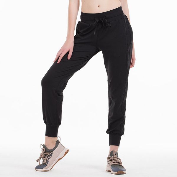 Yoga workout joggers for women with drawstring waist, side pockets, and sweat-wicking design