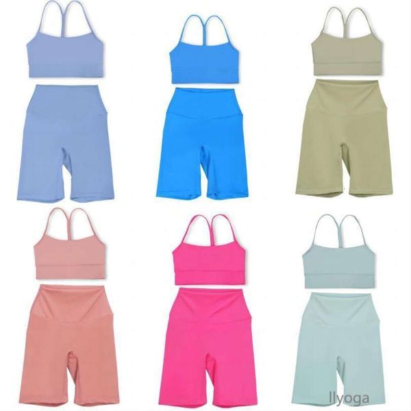Yoga workout set for women featuring a sport bra, fitness tank top, high-waisted tights, and biker shorts
