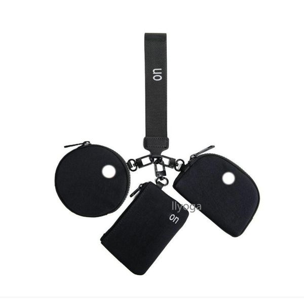 Yoga wristlet clutch with detachable zipper wrap and wrist guard, doubling as a portable gym wallet bag